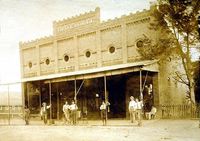 Geo Kroell Building with Men Standing out Front in Old Downtown Montevallo.jpg